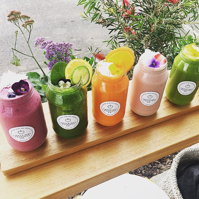 Real photography of 5 CCC smoothies in different flavours. Each flavour is a different vibrant colour and is topped with a special garnish.