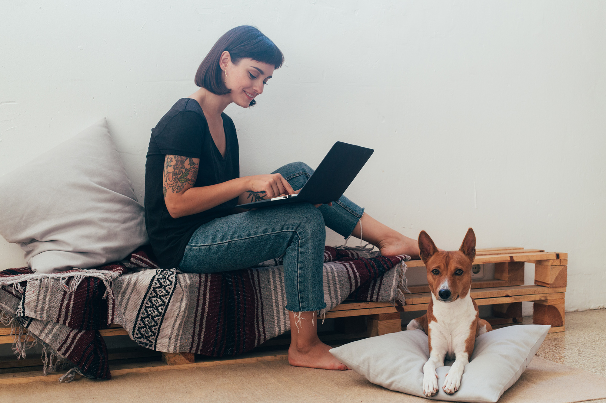 Woman working from home with dog