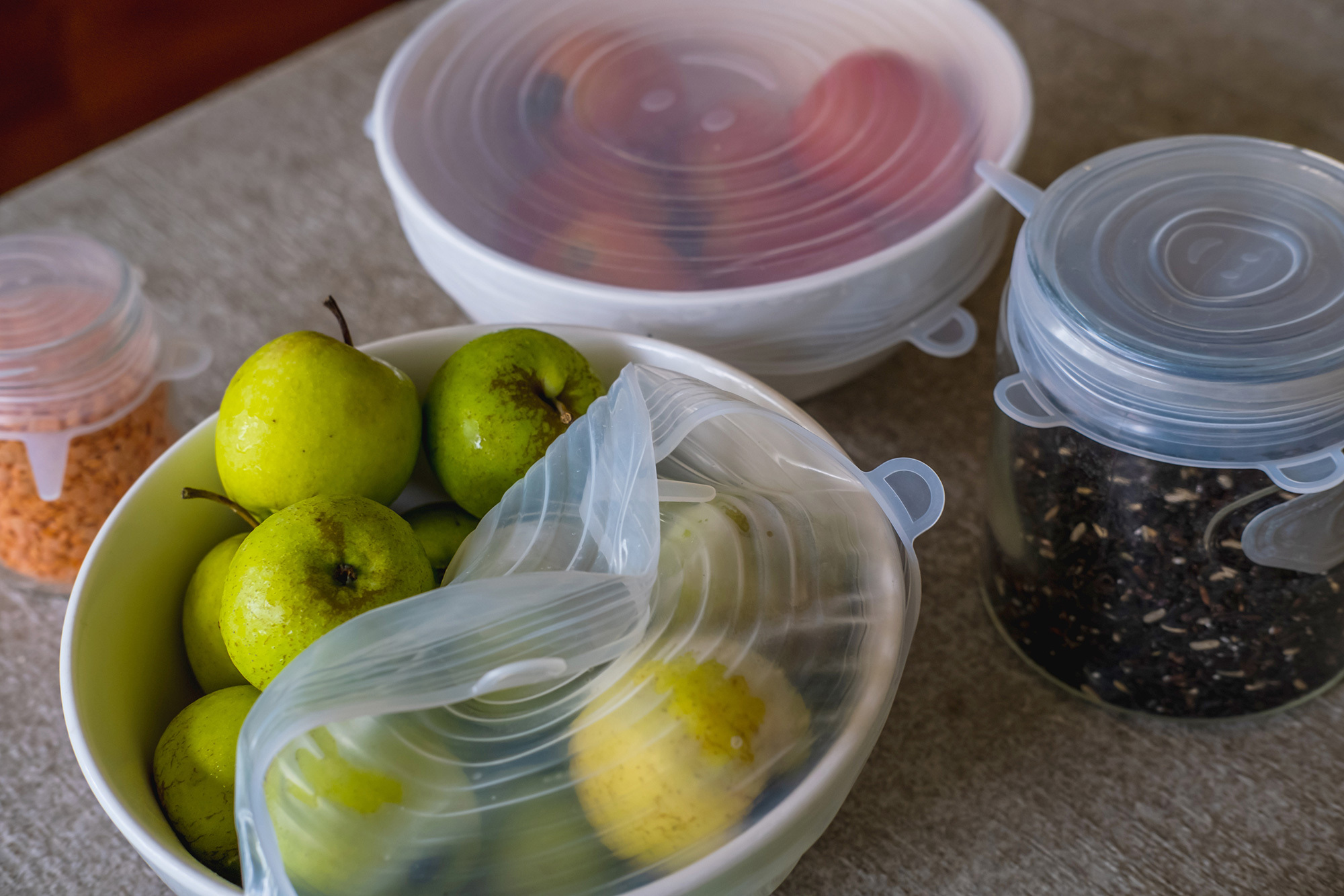 Image of fruits, vegetables and grains packed with environmentally safe round silicone stretch lids ready for storage