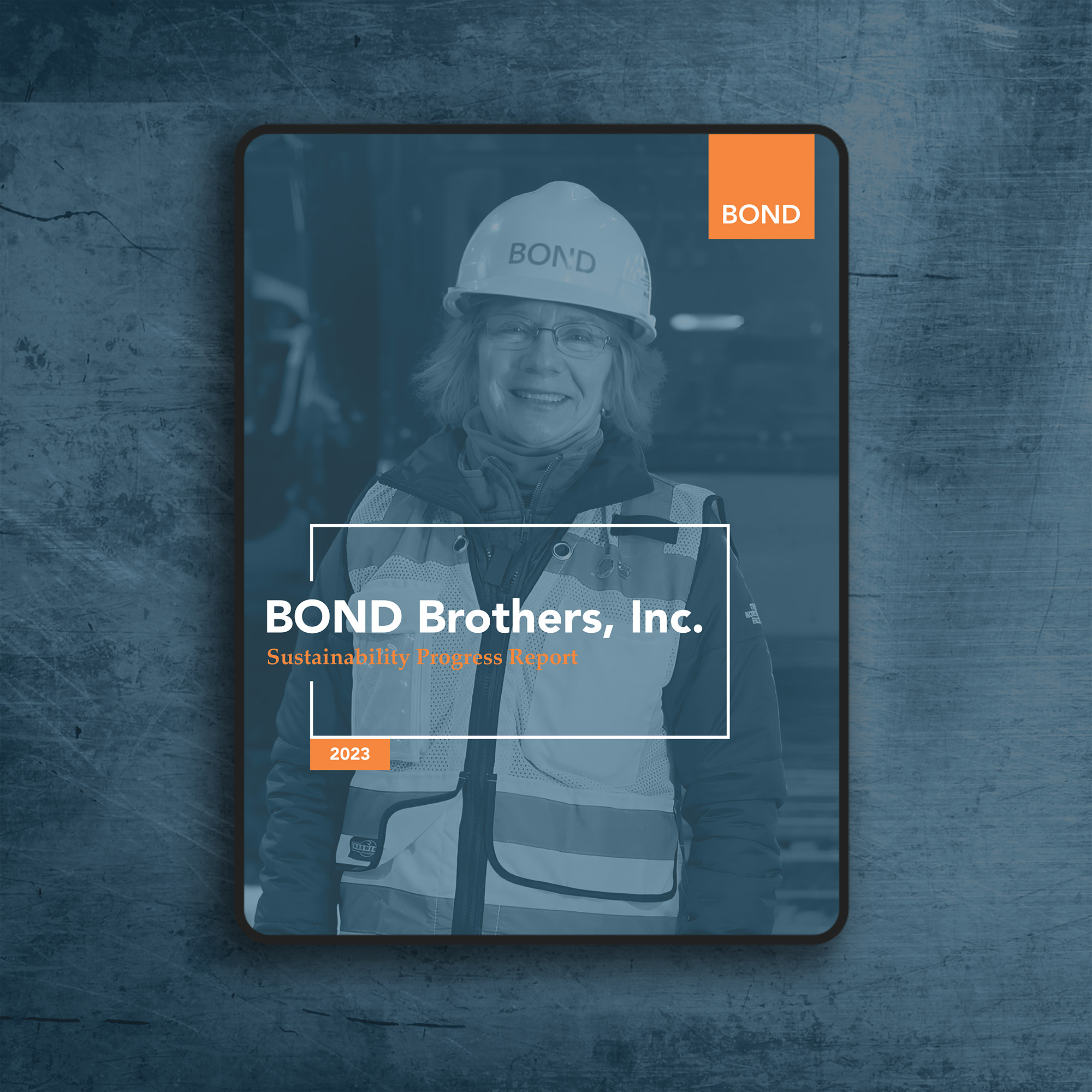 Cover of the BOND Brothers 2023 Sustainability Progress Report, featuring a portrait of a construction worker in safety gear, designed by Ethical Design Co.