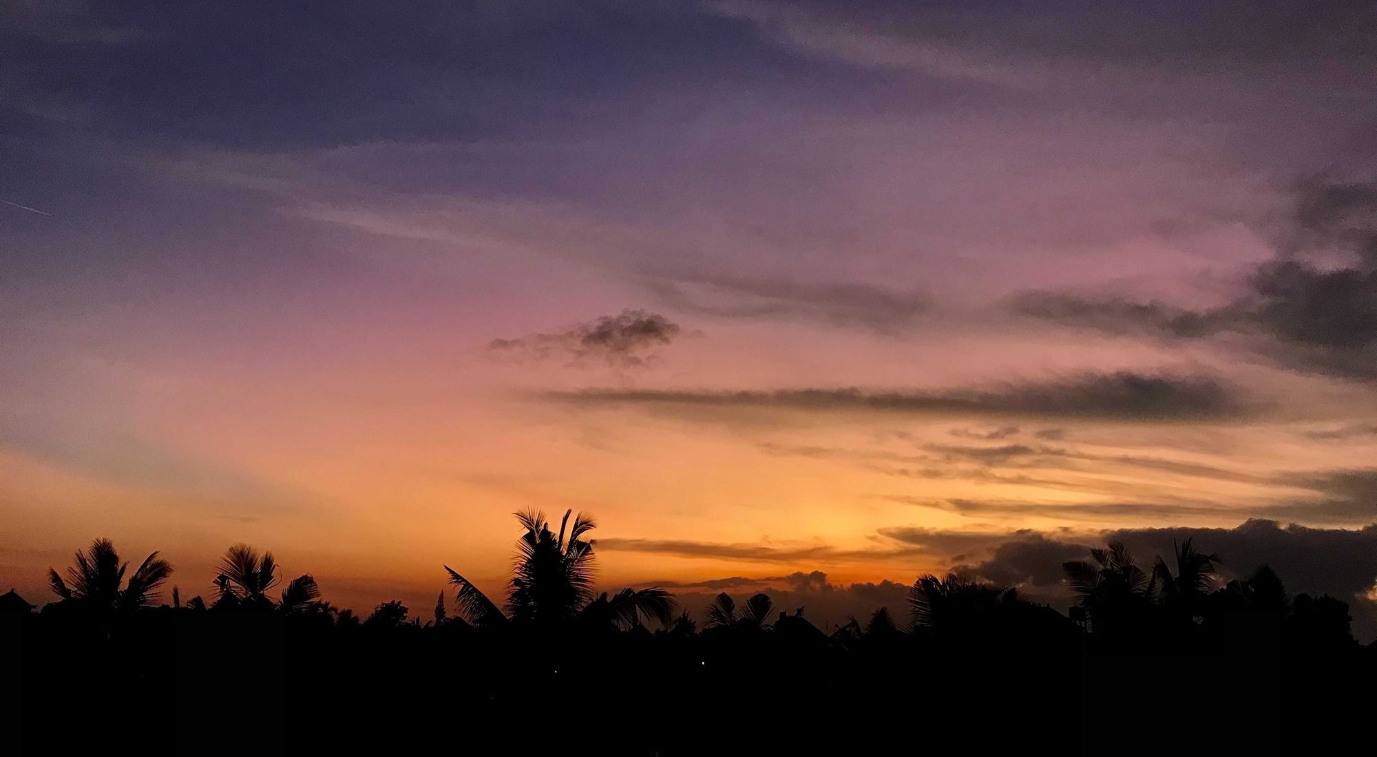 Real photo of a stunning sunset from Shan's homestay in Ubud, Bali. Photo credit: Shan Thoo.