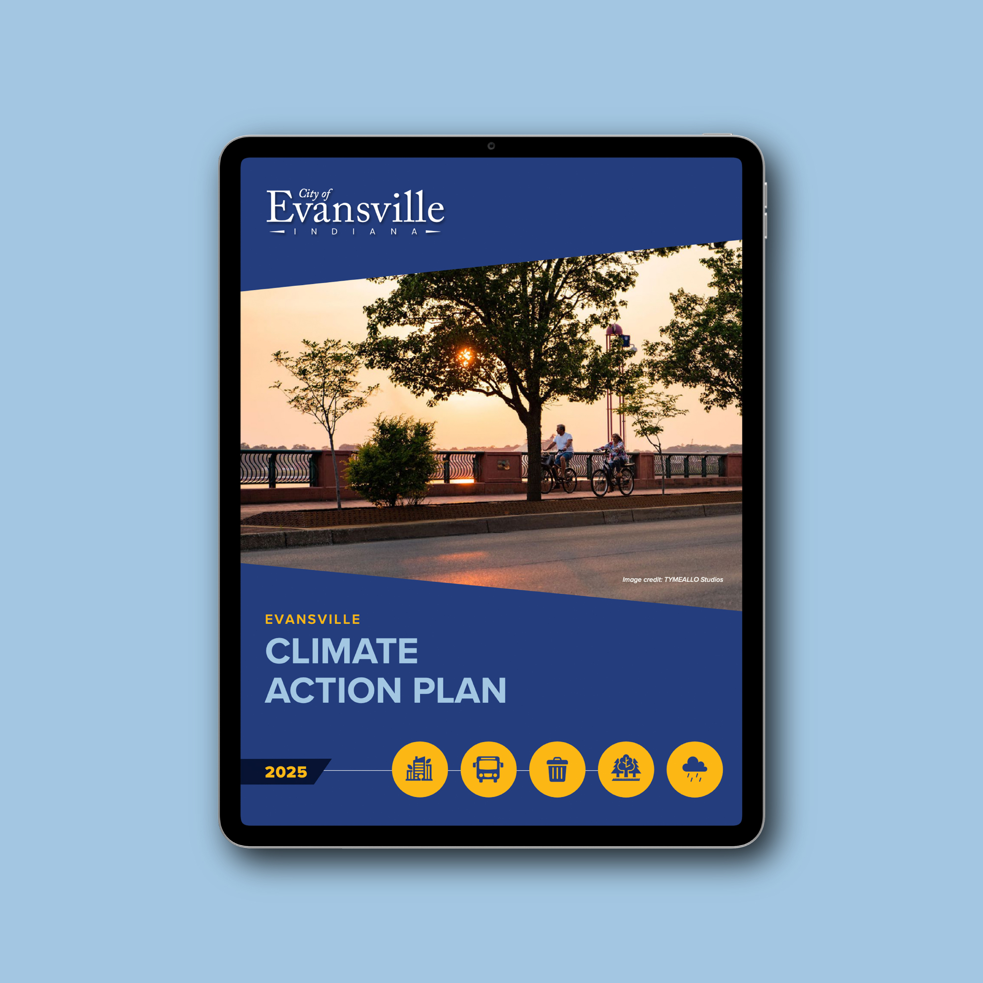 Tablet mockup of the City of Evansville Climate Action Plan 2025 cover design, featuring a photo of the riverfront at sunset with a blue and yellow angled graphic overlay and sector icons.