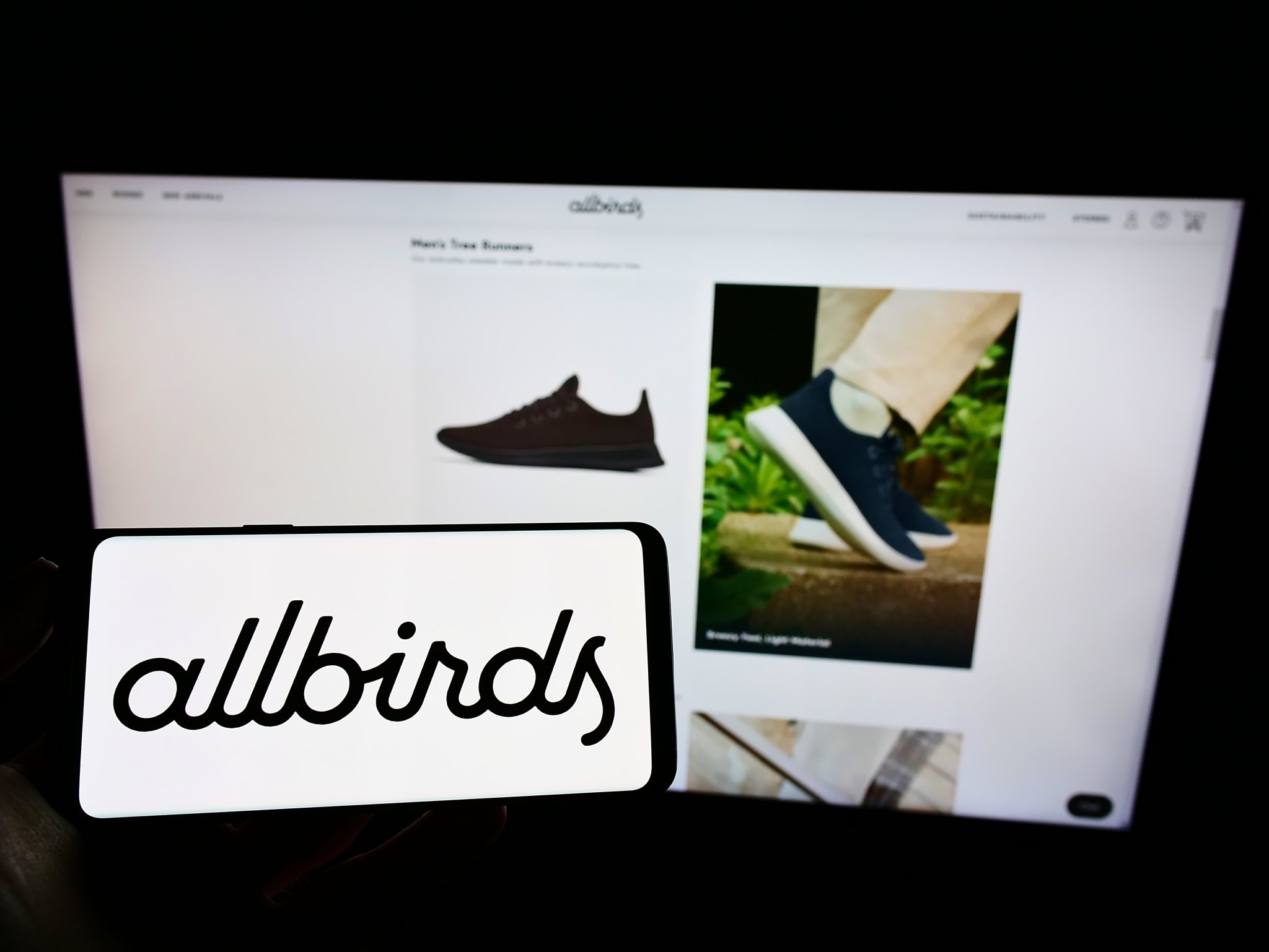 Allbirds website shown on screen, featuring a minimalist layout with clean navigation that supports sustainable and efficient UX design.