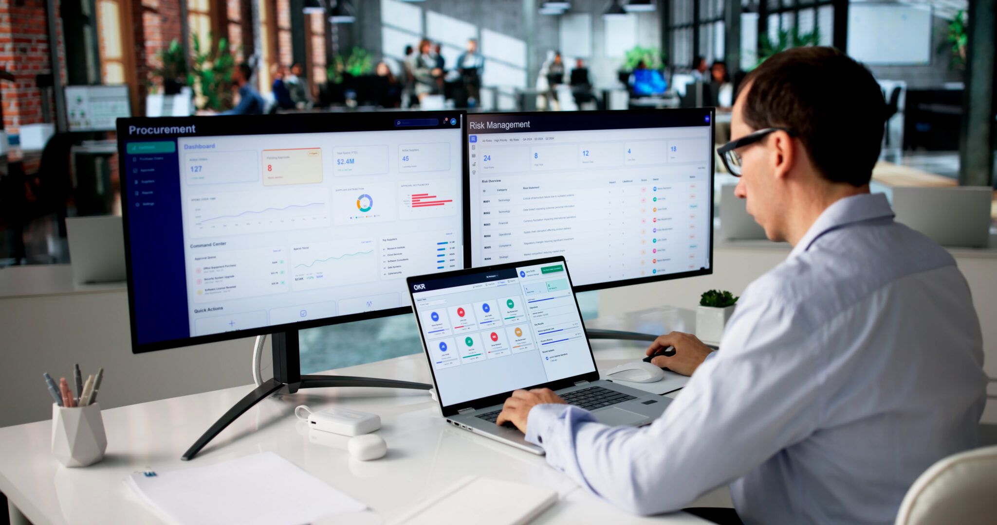 Person using laptop and dashboard screens to manage digital workflows, project tracking, and business systems